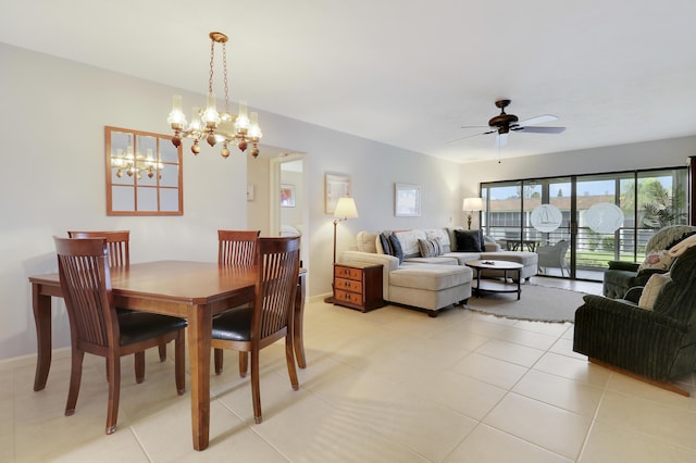 755 Saturn St Unit E 202, Jupiter, FL 33477 - dining space with ceiling fan, a chandelier, light tile patterned floors, and baseboards