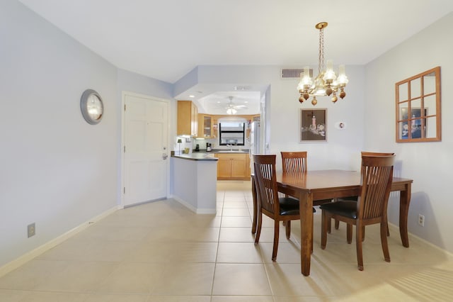 755 Saturn St Unit E 202, Jupiter, FL 33477 - dining area featuring a chandelier, a ceiling fan, baseboards, and light tile patterned flooring