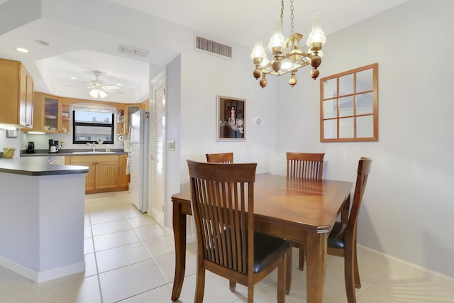 755 Saturn St Unit E 202, Jupiter, FL 33477 - dining space featuring a chandelier, ceiling fan, baseboards, and light tile patterned floors