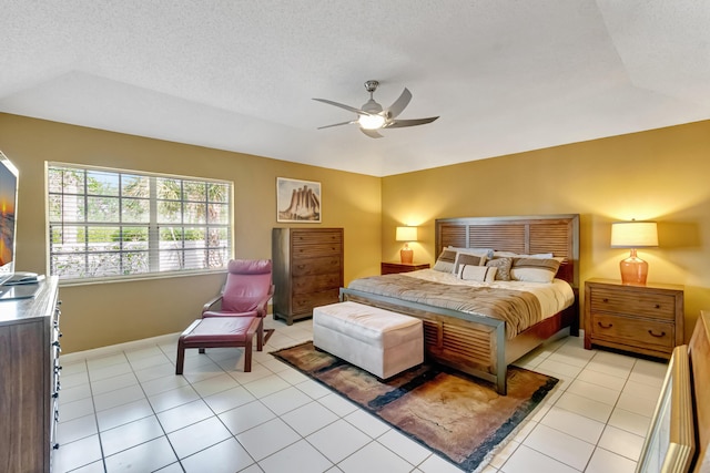 11650 Briarwood Cir Unit 2, Boynton Beach, FL 33437 - bedroom featuring baseboards, light tile patterned floors, a ceiling fan, and a textured ceiling