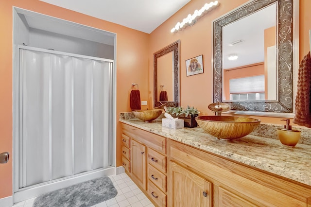 11650 Briarwood Cir Unit 2, Boynton Beach, FL 33437 - bathroom with a shower stall, double vanity, and tile patterned flooring