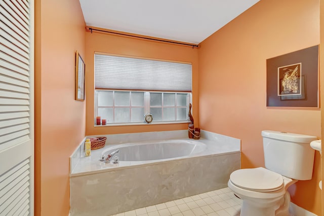 11650 Briarwood Cir Unit 2, Boynton Beach, FL 33437 - bathroom with tile patterned floors, toilet, and a bath