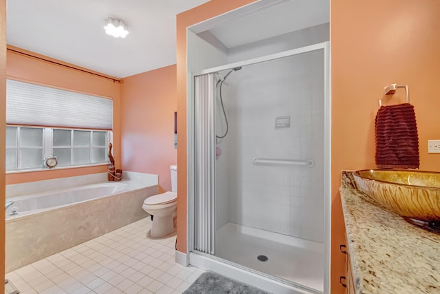 11650 Briarwood Cir Unit 2, Boynton Beach, FL 33437 - bathroom featuring tile patterned flooring, a shower stall, a garden tub, toilet, and a sink