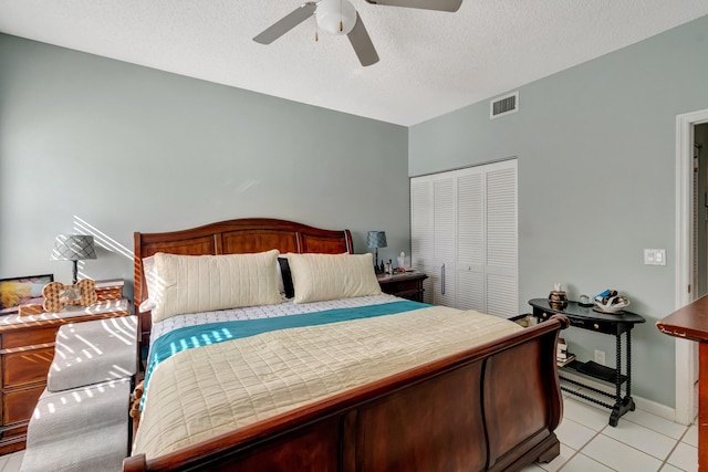 11650 Briarwood Cir Unit 2, Boynton Beach, FL 33437 - bedroom with a closet, light tile patterned floors, ceiling fan, and baseboards