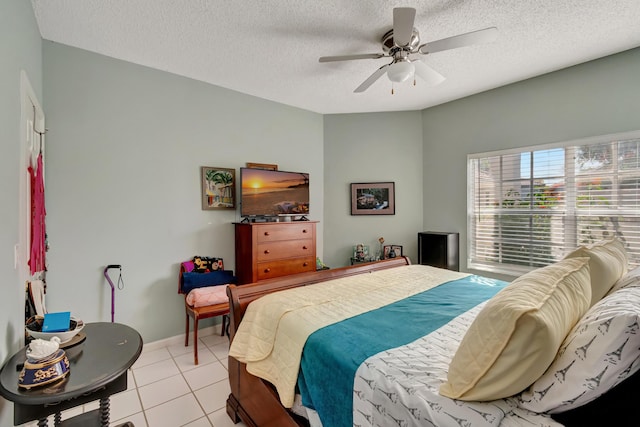11650 Briarwood Cir Unit 2, Boynton Beach, FL 33437 - bedroom with a textured ceiling, light tile patterned floors, ceiling fan, and baseboards