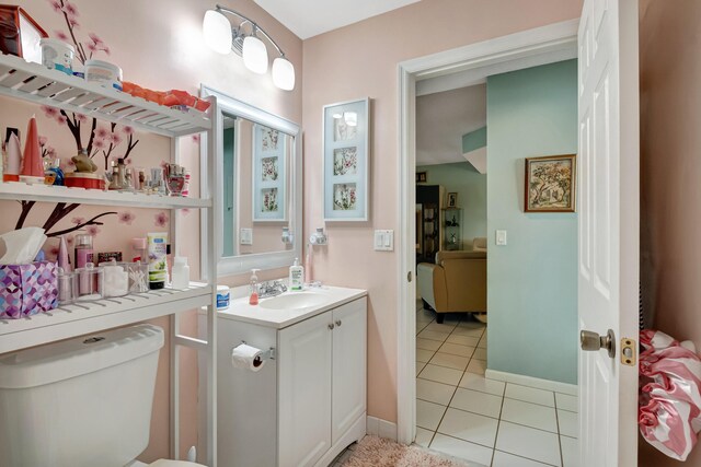 11650 Briarwood Cir Unit 2, Boynton Beach, FL 33437 - bathroom with tile patterned flooring, vanity, toilet, and baseboards