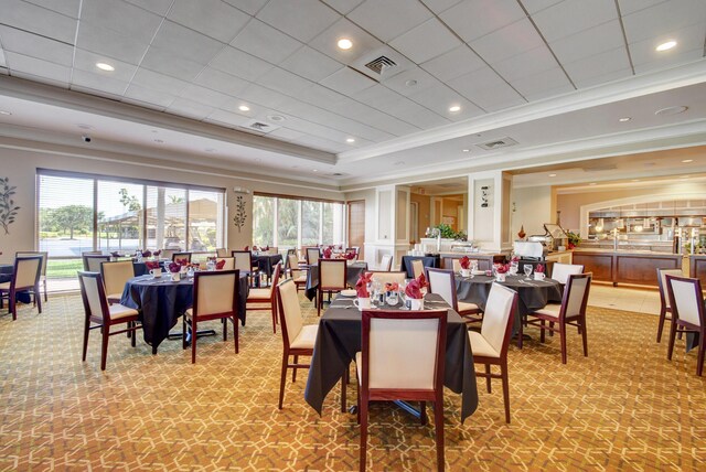 11650 Briarwood Cir Unit 2, Boynton Beach, FL 33437 - dining room featuring ornamental molding, healthy amount of natural light, a tray ceiling, and light colored carpet
