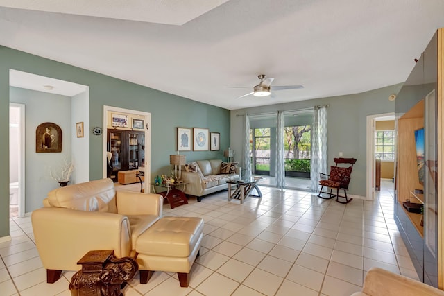 11650 Briarwood Cir Unit 2, Boynton Beach, FL 33437 - living area featuring ceiling fan, light tile patterned floors, and baseboards