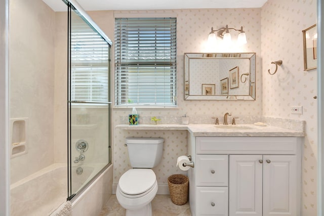 3321 Southern Cay Dr, Jupiter, FL 33477 - full bathroom with wallpapered walls, bath / shower combo with glass door, toilet, vanity, and tile patterned floors