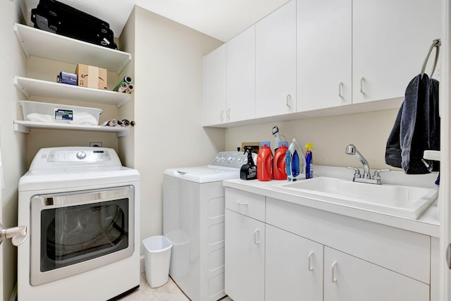 3321 Southern Cay Dr, Jupiter, FL 33477 - washroom with washer and dryer, cabinet space, and light tile patterned floors