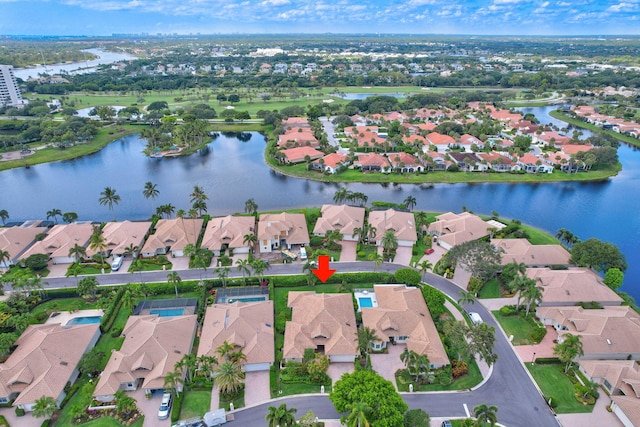 3321 Southern Cay Dr, Jupiter, FL 33477 - aerial view of property and surrounding area featuring nearby suburban area and a large body of water