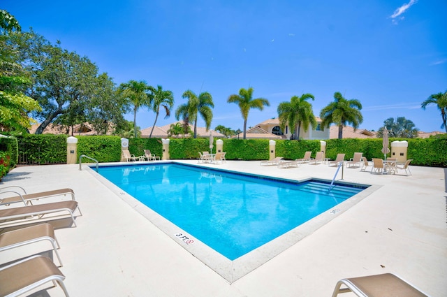 3321 Southern Cay Dr, Jupiter, FL 33477 - community pool featuring a patio area