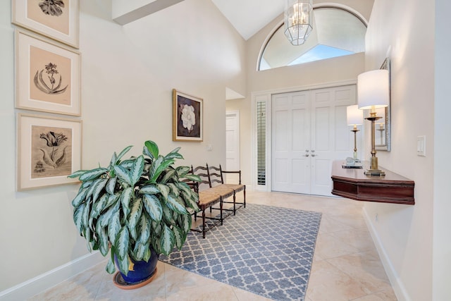 3321 Southern Cay Dr, Jupiter, FL 33477 - tiled entrance foyer with a chandelier, baseboards, and high vaulted ceiling