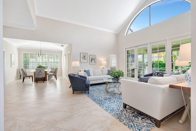 3321 Southern Cay Dr, Jupiter, FL 33477 - living room with light tile patterned flooring, a chandelier, crown molding, high vaulted ceiling, and baseboards