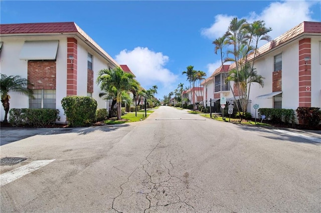 3550 NW 8th Ave Unit 604, Pompano Beach, FL 33064 - view of asphalt street with a residential view and traffic signs