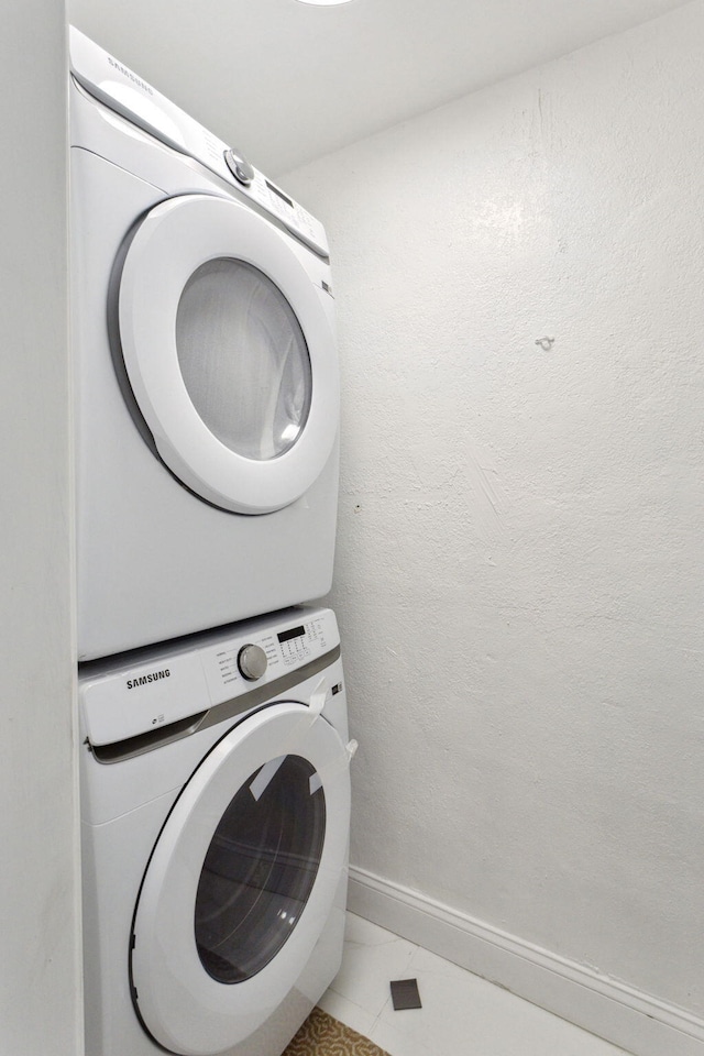 1530 NW 18th Ct, Fort Lauderdale, FL 33311 - laundry room with stacked washer / dryer and baseboards