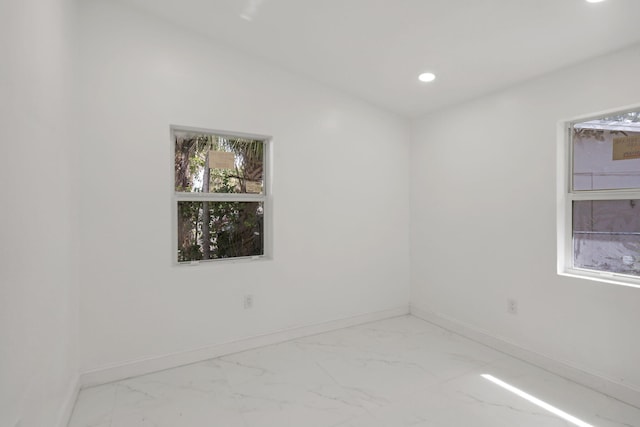 1530 NW 18th Ct, Fort Lauderdale, FL 33311 - unfurnished room with marble look tiles, baseboards, and recessed lighting