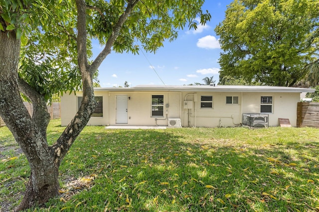 1530 NW 18th Ct, Fort Lauderdale, FL 33311 - rear view of property featuring stucco siding, cooling unit, ac unit, and a patio area