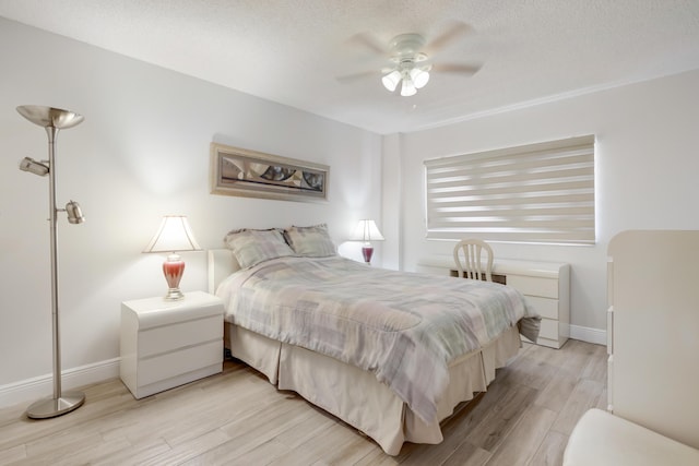 3326 Arcara Way Unit 416, Lake Worth, FL 33467 - bedroom featuring light wood-style flooring, baseboards, and a ceiling fan