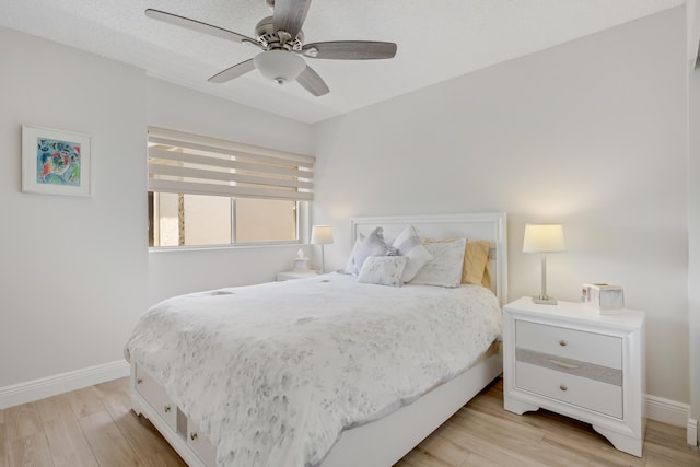 3326 Arcara Way Unit 416, Lake Worth, FL 33467 - bedroom with light wood-style flooring, baseboards, and ceiling fan