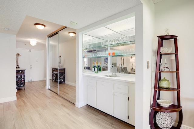 3326 Arcara Way Unit 416, Lake Worth, FL 33467 - indoor wet bar with light wood-style flooring and baseboards