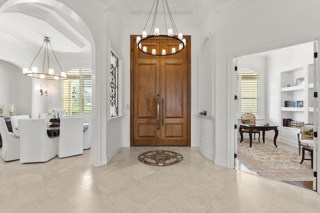 9212 Perth Rd, Lake Worth, FL 33467 - entryway featuring a chandelier, crown molding, baseboards, and arched walkways