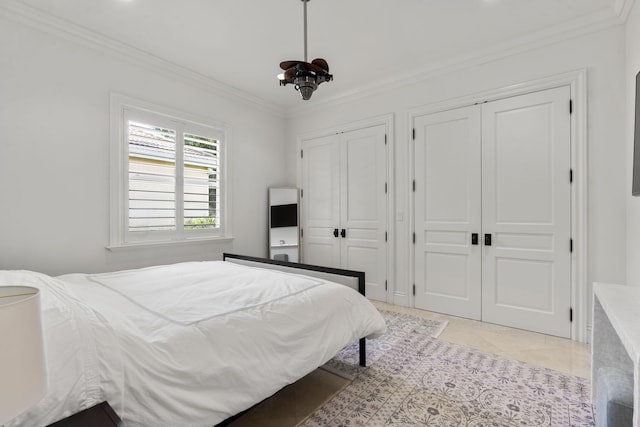 9212 Perth Rd, Lake Worth, FL 33467 - bedroom featuring two closets and crown molding