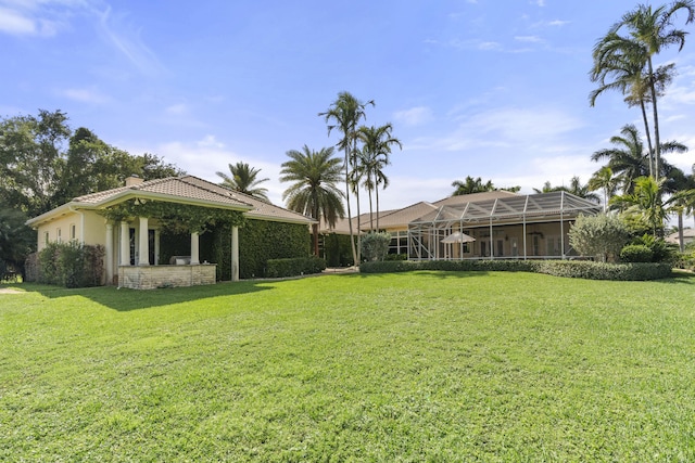 9212 Perth Rd, Lake Worth, FL 33467 - view of green lawn with glass enclosure