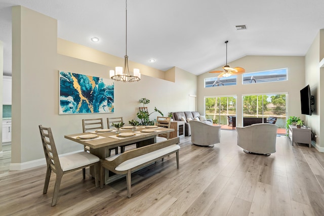 10560 Plainview Cir, Boca Raton, FL 33498 - dining space featuring ceiling fan, light wood-style floors, a chandelier, high vaulted ceiling, and baseboards