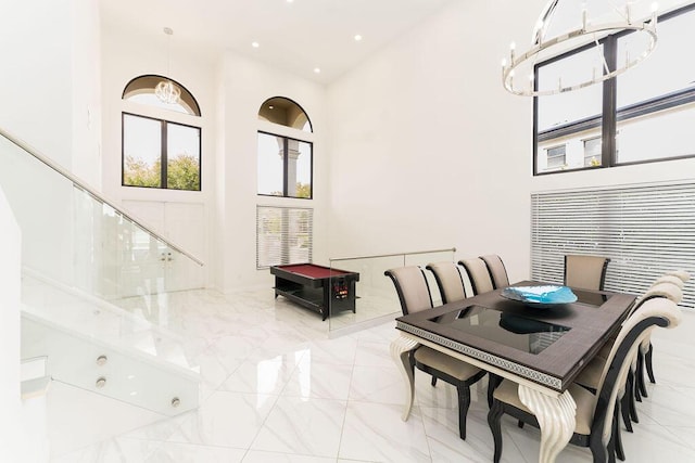 9475 Equus Cir, Boynton Beach, FL 33472 - dining room featuring a high ceiling, marble tiled flooring, a chandelier, and recessed lighting