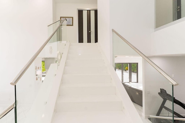 9475 Equus Cir, Boynton Beach, FL 33472 - stairway featuring a towering ceiling
