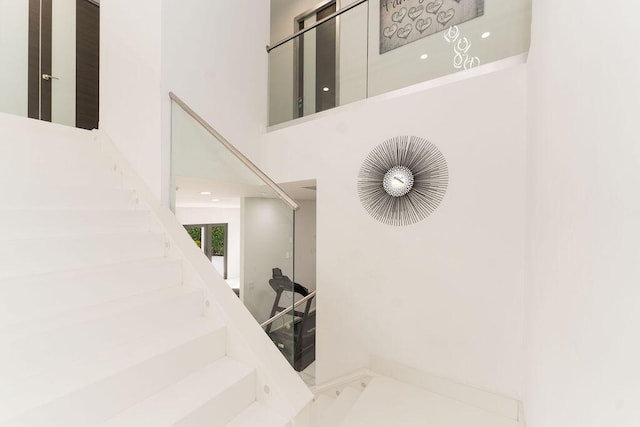 9475 Equus Cir, Boynton Beach, FL 33472 - stairs featuring marble finish flooring and a towering ceiling