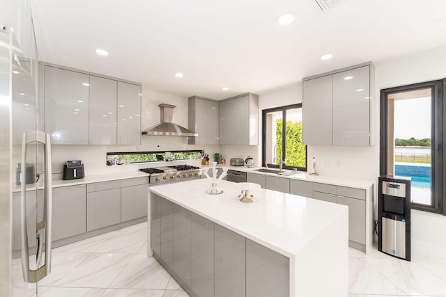 9475 Equus Cir, Boynton Beach, FL 33472 - kitchen featuring gray cabinetry, wall chimney exhaust hood, modern cabinets, a sink, and recessed lighting