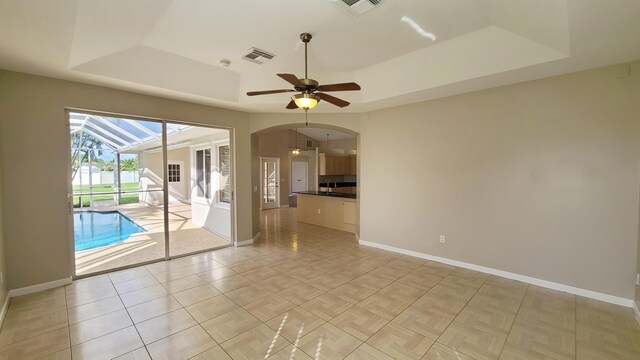 5170 NW Aljo Ct, Port Saint Lucie, FL 34986 - unfurnished room with a raised ceiling and baseboards
