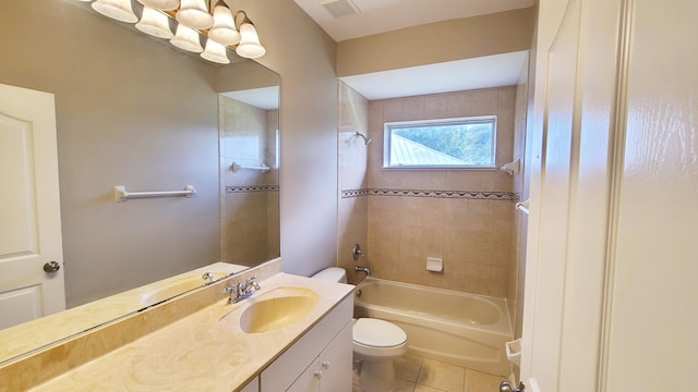 5170 NW Aljo Ct, Port Saint Lucie, FL 34986 - full bathroom with toilet, vanity, tile patterned flooring, and tub / shower combination