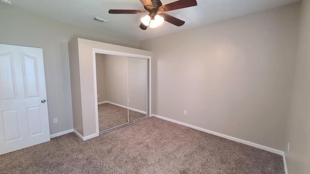 5170 NW Aljo Ct, Port Saint Lucie, FL 34986 - unfurnished bedroom with carpet floors, a closet, a ceiling fan, and baseboards