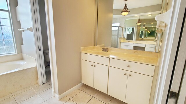 5170 NW Aljo Ct, Port Saint Lucie, FL 34986 - bathroom featuring tile patterned floors, a garden tub, vanity, and a shower stall