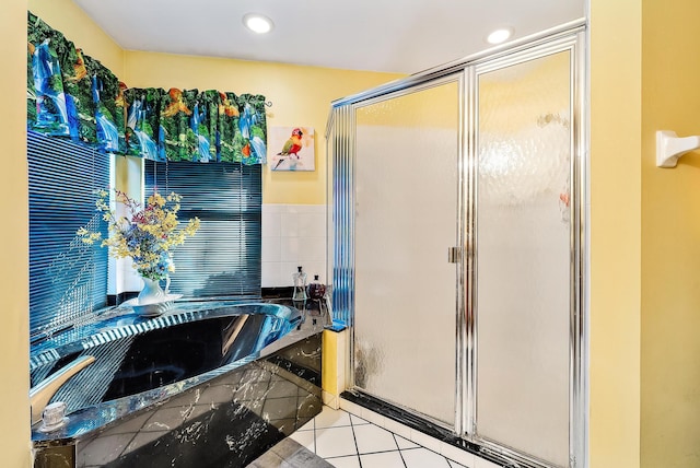 17862 123rd Ter N, Jupiter, FL 33478 - bathroom with a stall shower, tile patterned flooring, and a bath