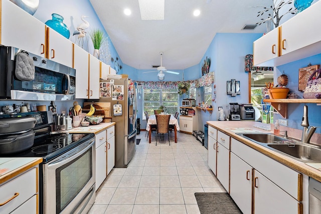 17862 123rd Ter N, Jupiter, FL 33478 - kitchen with appliances with stainless steel finishes, light countertops, a sink, a ceiling fan, and white cabinetry