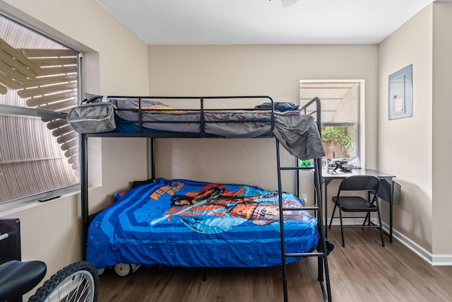 1214 Peak Rd, Lantana, FL 33462 - bedroom with wood finished floors, baseboards, and electric panel