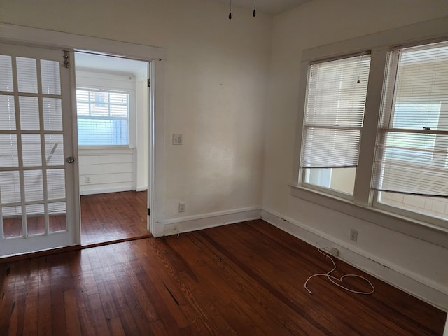 1512 Florida Ave Unit A/B, West Palm Beach, FL 33401 - unfurnished room featuring dark wood-type flooring and baseboards