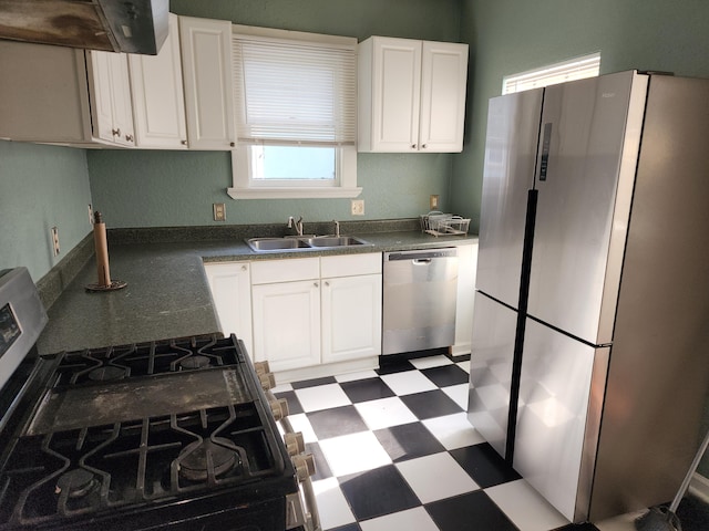 1512 Florida Ave Unit A/B, West Palm Beach, FL 33401 - kitchen featuring appliances with stainless steel finishes, a sink, tile patterned floors, ventilation hood, and white cabinetry