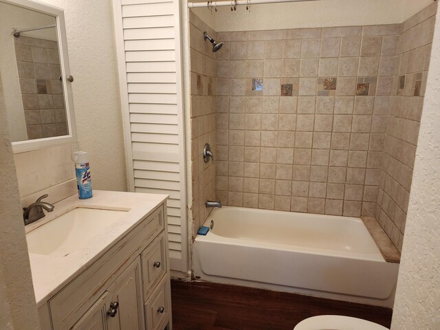 1512 Florida Ave Unit A/B, West Palm Beach, FL 33401 - full bath featuring vanity, shower / bath combination, a textured wall, and toilet