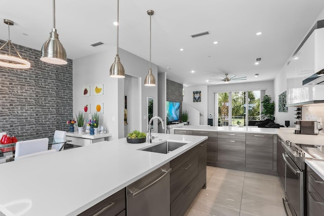 4021 NW 18th Way, Boca Raton, FL 33431 - kitchen featuring appliances with stainless steel finishes, a sink, light countertops, ceiling fan, and light tile patterned flooring
