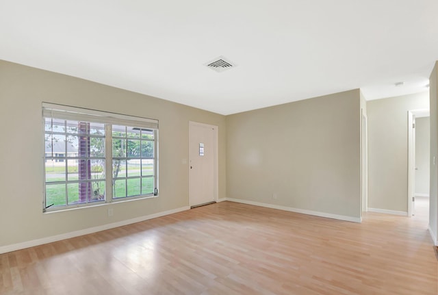 1103 NW 7th Ct, Boynton Beach, FL 33426 - unfurnished room featuring light wood finished floors and baseboards