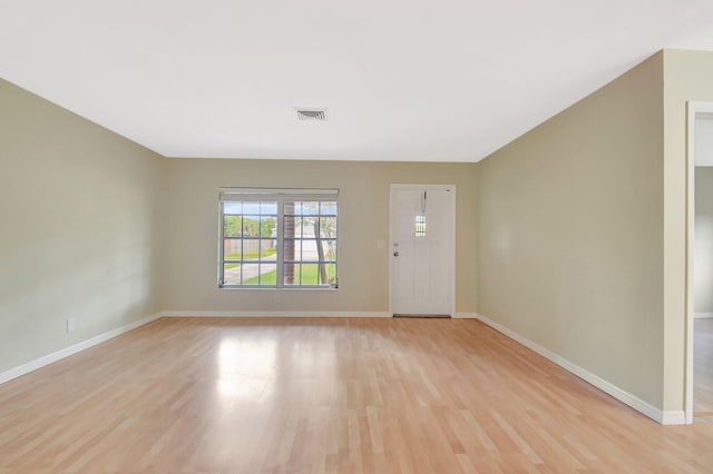 1103 NW 7th Ct, Boynton Beach, FL 33426 - foyer entrance with light wood-type flooring and baseboards