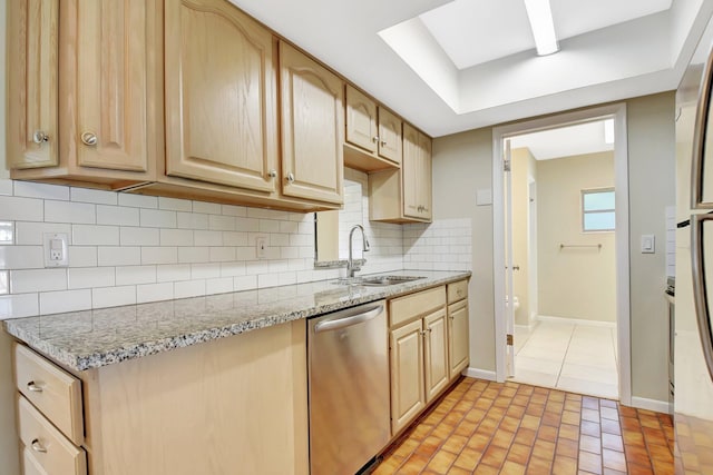 1103 NW 7th Ct, Boynton Beach, FL 33426 - kitchen with stainless steel dishwasher, a sink, light brown cabinetry, and baseboards