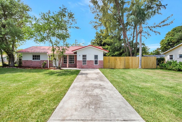 1103 NW 7th Ct, Boynton Beach, FL 33426 - ranch-style home with brick siding, stucco siding, concrete driveway, and a tile roof