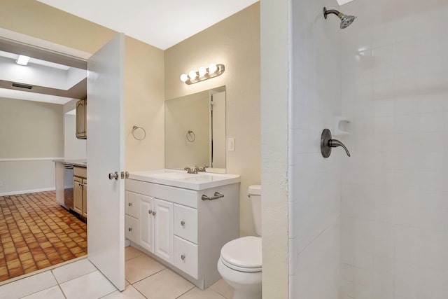 1103 NW 7th Ct, Boynton Beach, FL 33426 - bathroom with toilet, vanity, a tile shower, and tile patterned floors