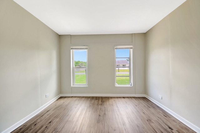 1103 NW 7th Ct, Boynton Beach, FL 33426 - empty room with wood finished floors and baseboards